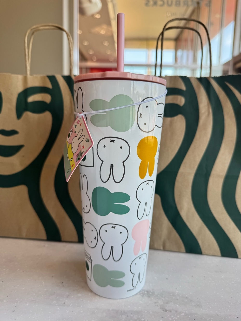 Starbucks White Tumbler with Pink Lid and Multicolor Bunny Design